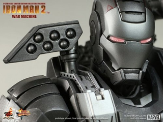 Illustration for article titled How Does War Machine's Gun Work? Can He Sit Down? New Toy Pics Reveal All!